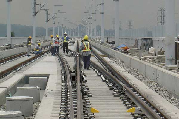 fixing ballasted rail sleepers